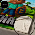 Detailed view of the soft Minky fabric lining on a custom gamer blanket, showing the smooth, plush, and velvet-like finish.